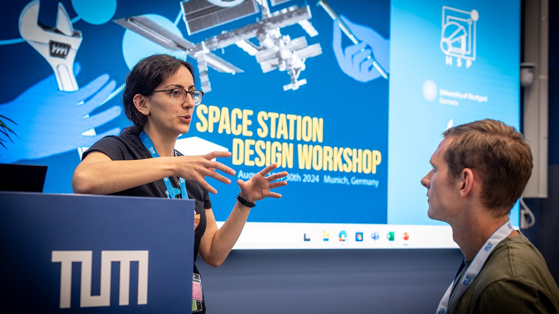 Participants talk at the Space Station Design Workshop