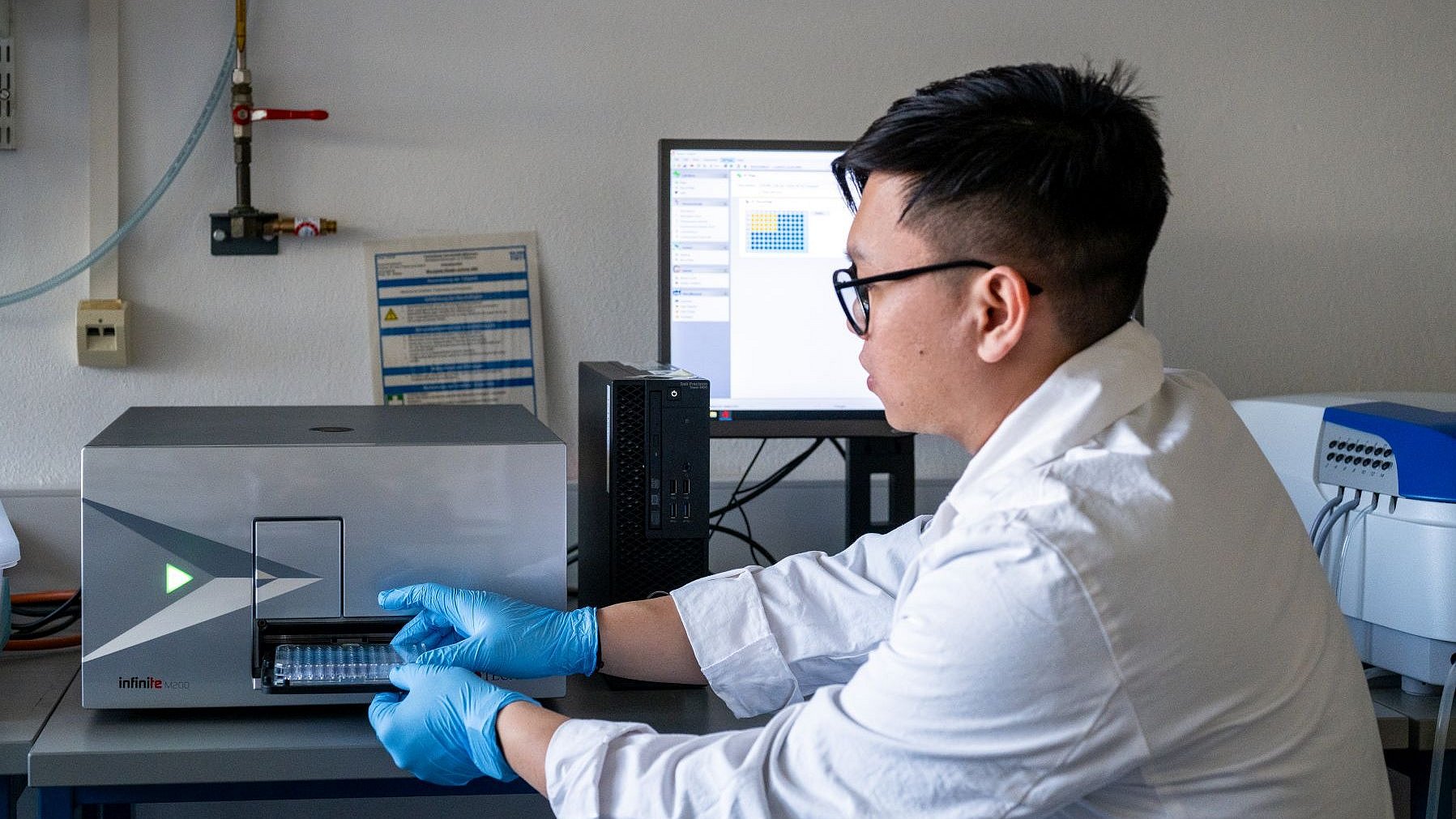 Victor Christian Kaharso examines the samples collected during his experiments.