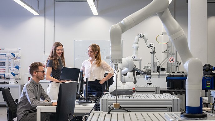 Researchers in one of TUM's robotics labs