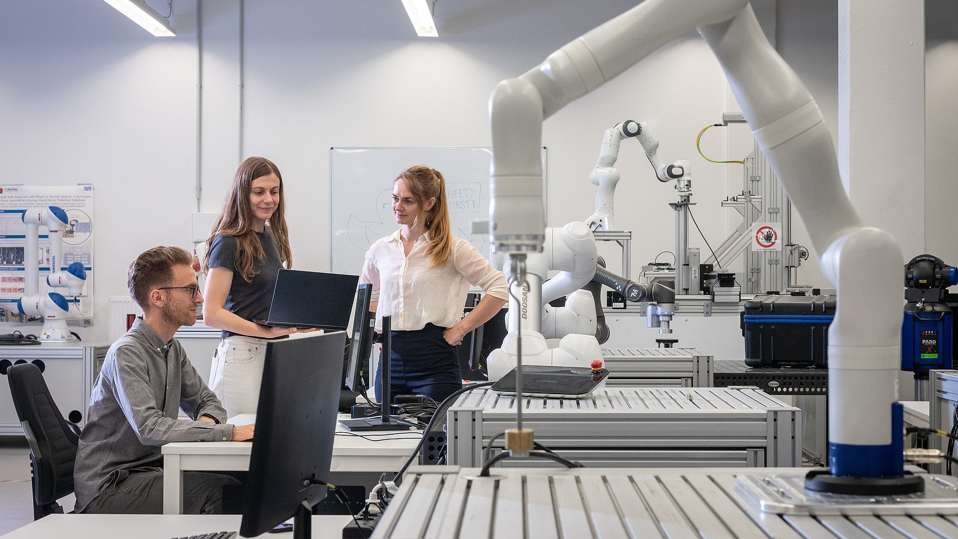 Researchers in one of TUM's robotics labs
