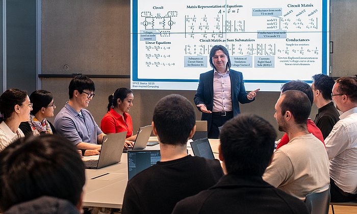 A professor with students in a lesson.