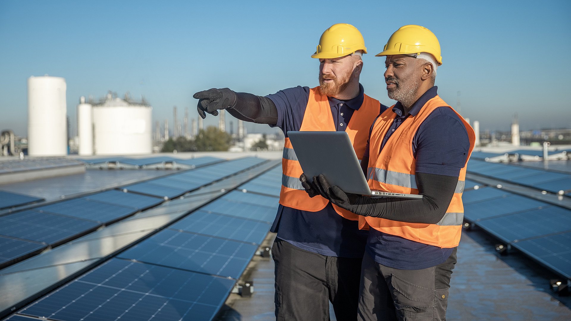 Two engineers inspect a photovoltaic system.