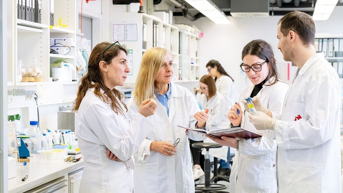 Aphrodite Kapurniotu and her team in the laboratory