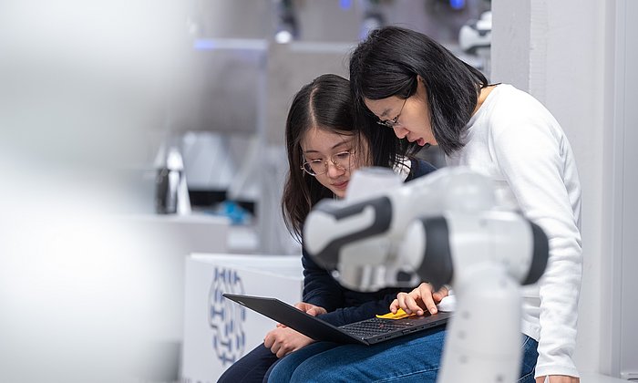 Doctorate Kejia Chen is discussing results with her colleague Jingyun Zhao.