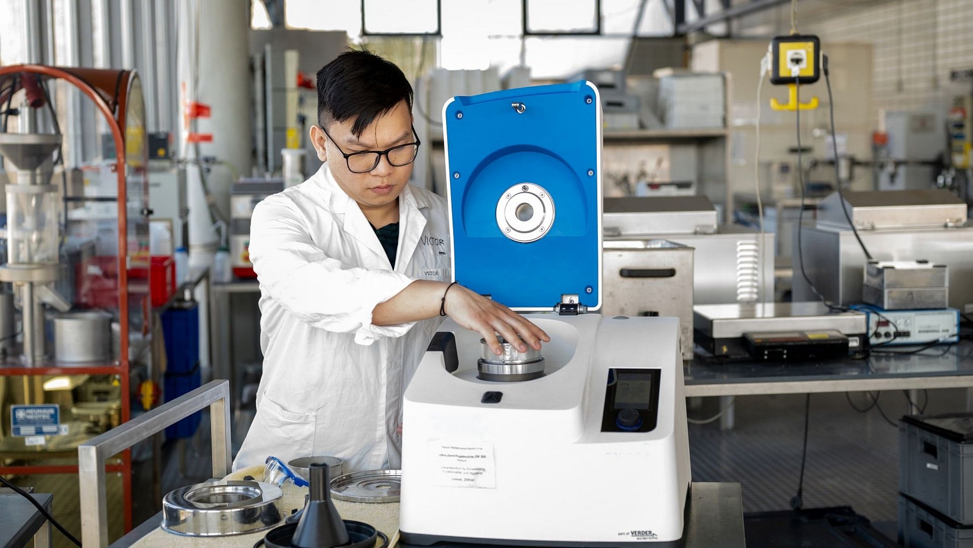 In the laboratory, Victor Christian uses an ultracentrifugal mill to grind the cowpeas into flour.