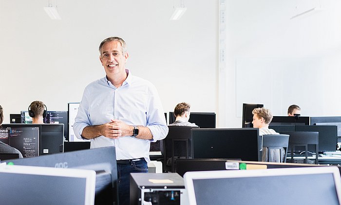 Prof. Daniel Rückert with his team at work in his lab.