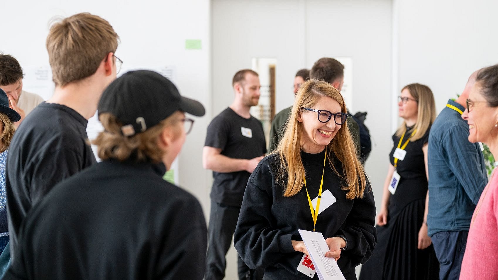 Prof. Annette Diefenthaler (center) with her students at the “Creative Collisions” event at the Munich Design Institute.