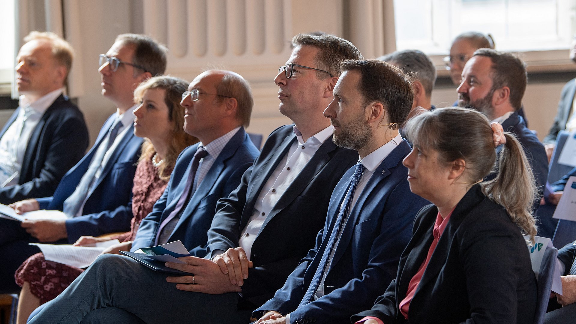 The founding directors Prof. Günnemann and Prof. Kutyniok with Science Minister Markus Blume.