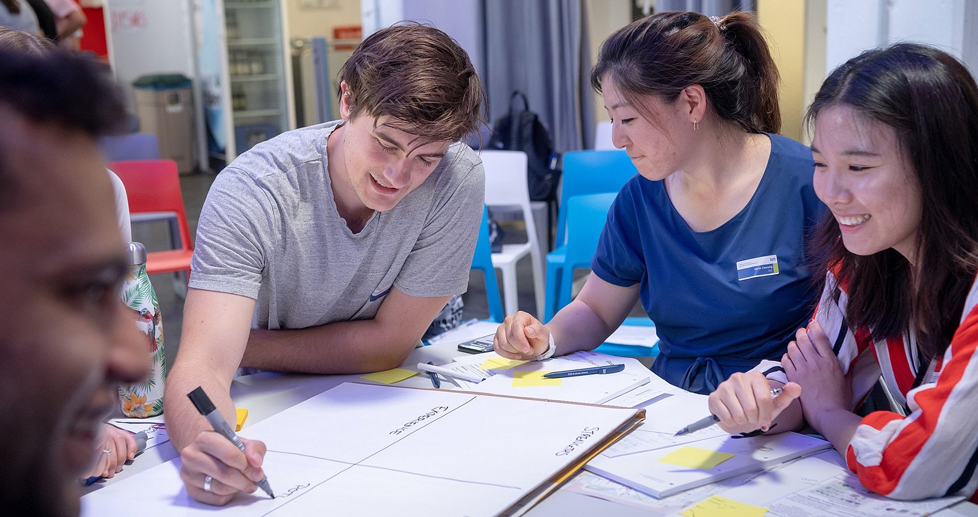 International Students working together on a project, illustration of internationali spirit on campus